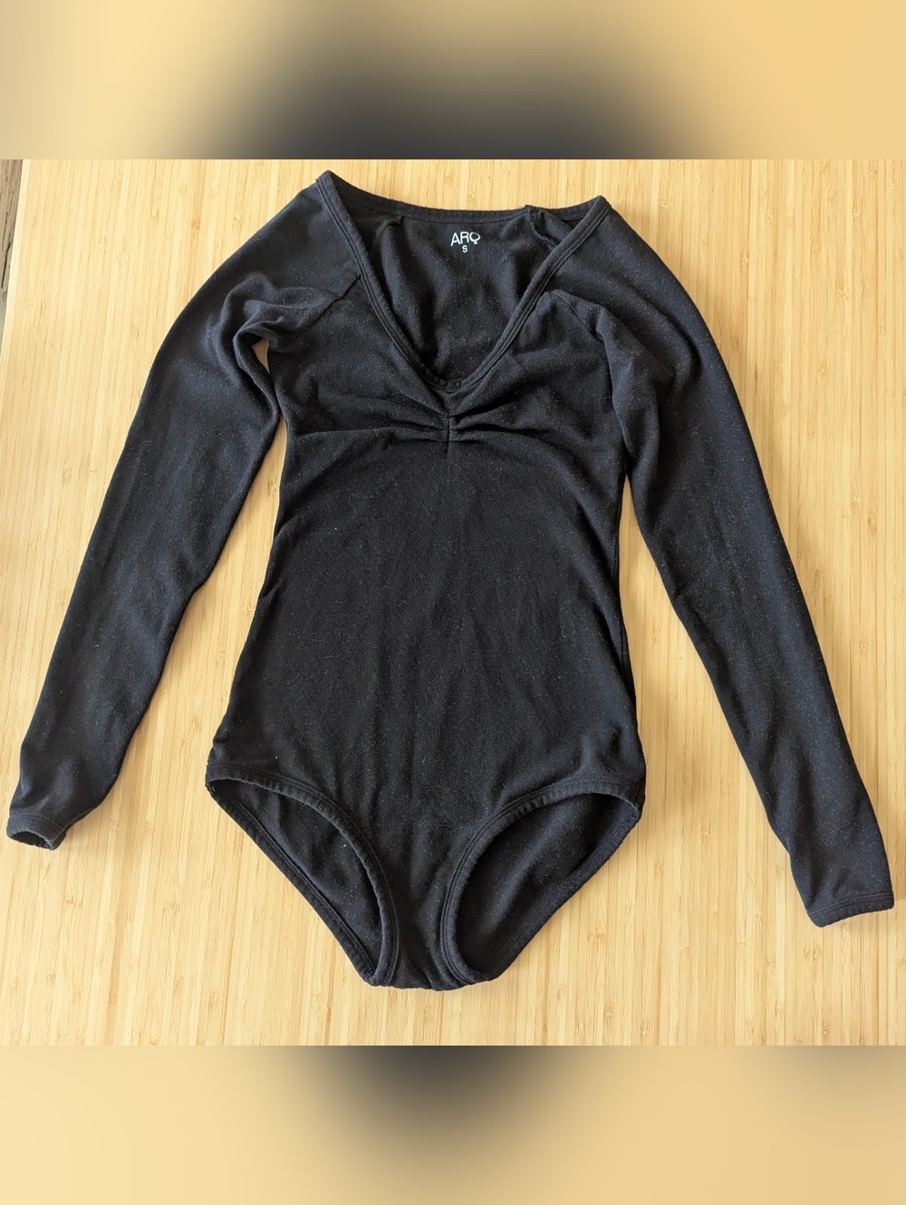 $45 - Paloma Leo ARQ Black Long-Sleeve Ruched V-Neck Bodysuit